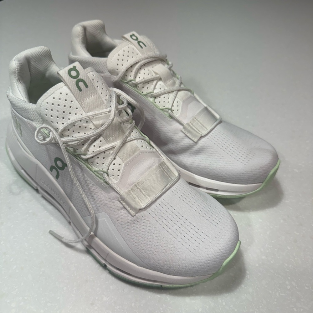On Running White Sneakers with Green Accents